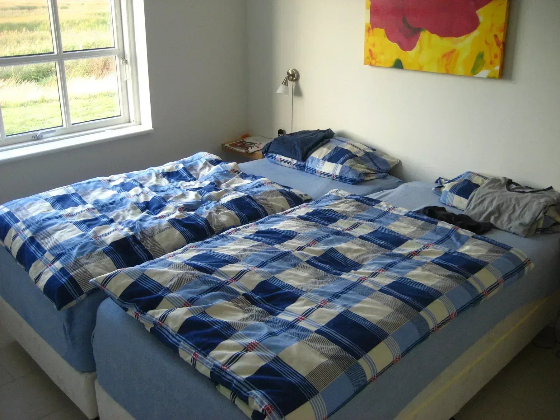 Schlafzimmer mit drei Betten in einem Ferienhaus in Bagenkop, Dänemark